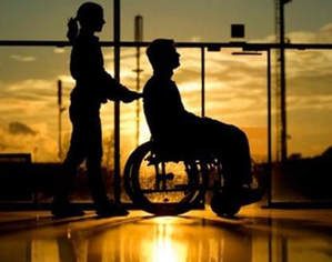 Medical professional assisting someone is a wheelchair